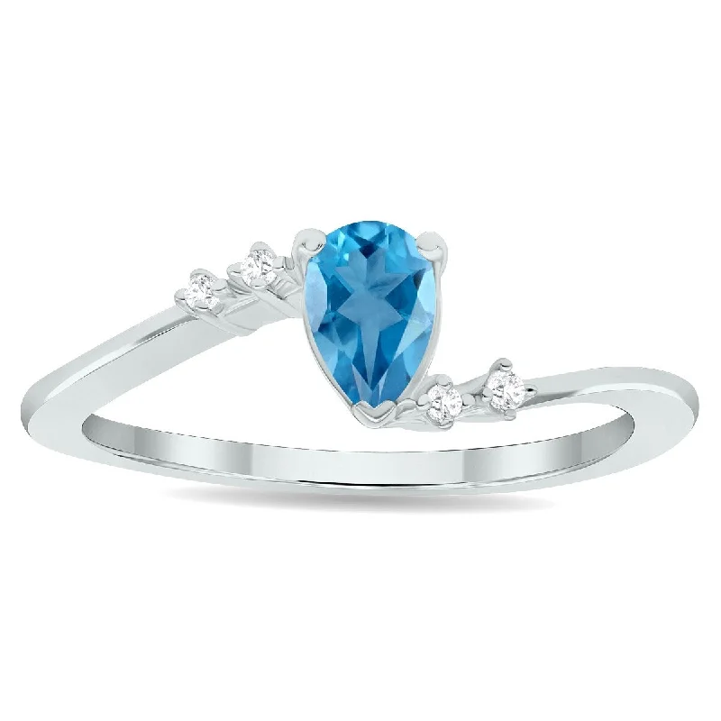 Women’s carved ring-Women's Blue Topaz and Diamond Wave Ring in 10K White Gold