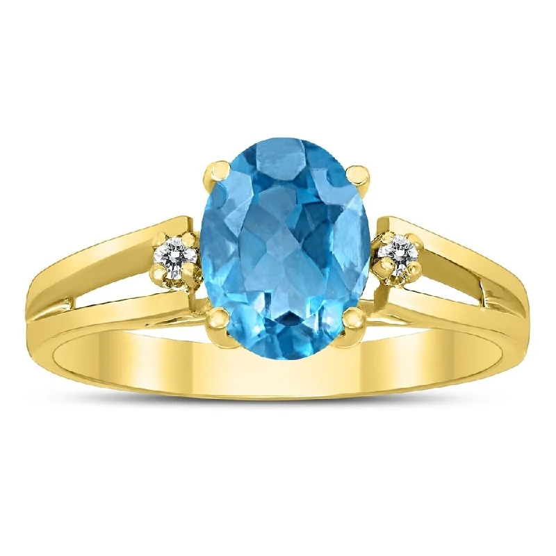 Women’s silver ring-8X6MM Blue Topaz and Diamond Open Three Stone Ring in 10K Yellow Gold