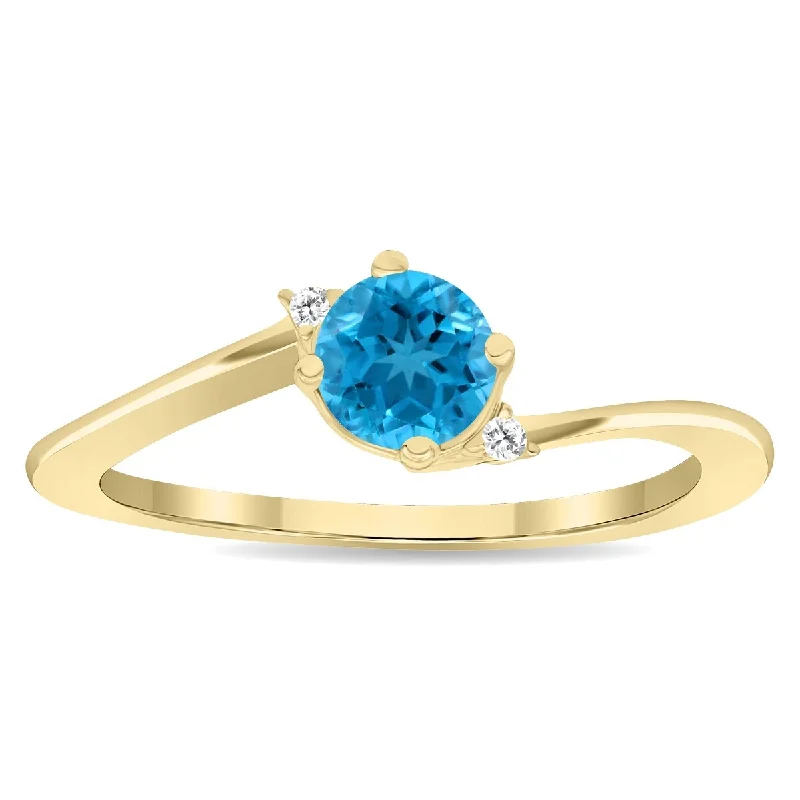 Women’s multi-stone ring-Women's Round Shaped Blue Topaz and Diamond Wave Ring in 10K Yellow Gold