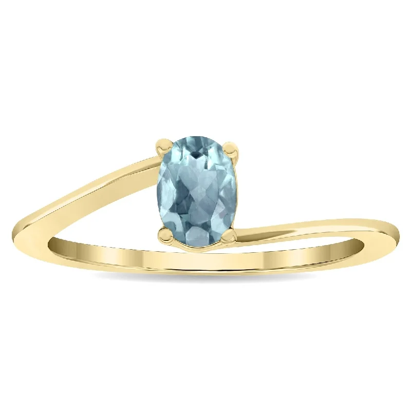 Women’s wedding band ring-Women's Solitaire Oval Shaped Aquamarine Wave Ring in 10K Yellow Gold